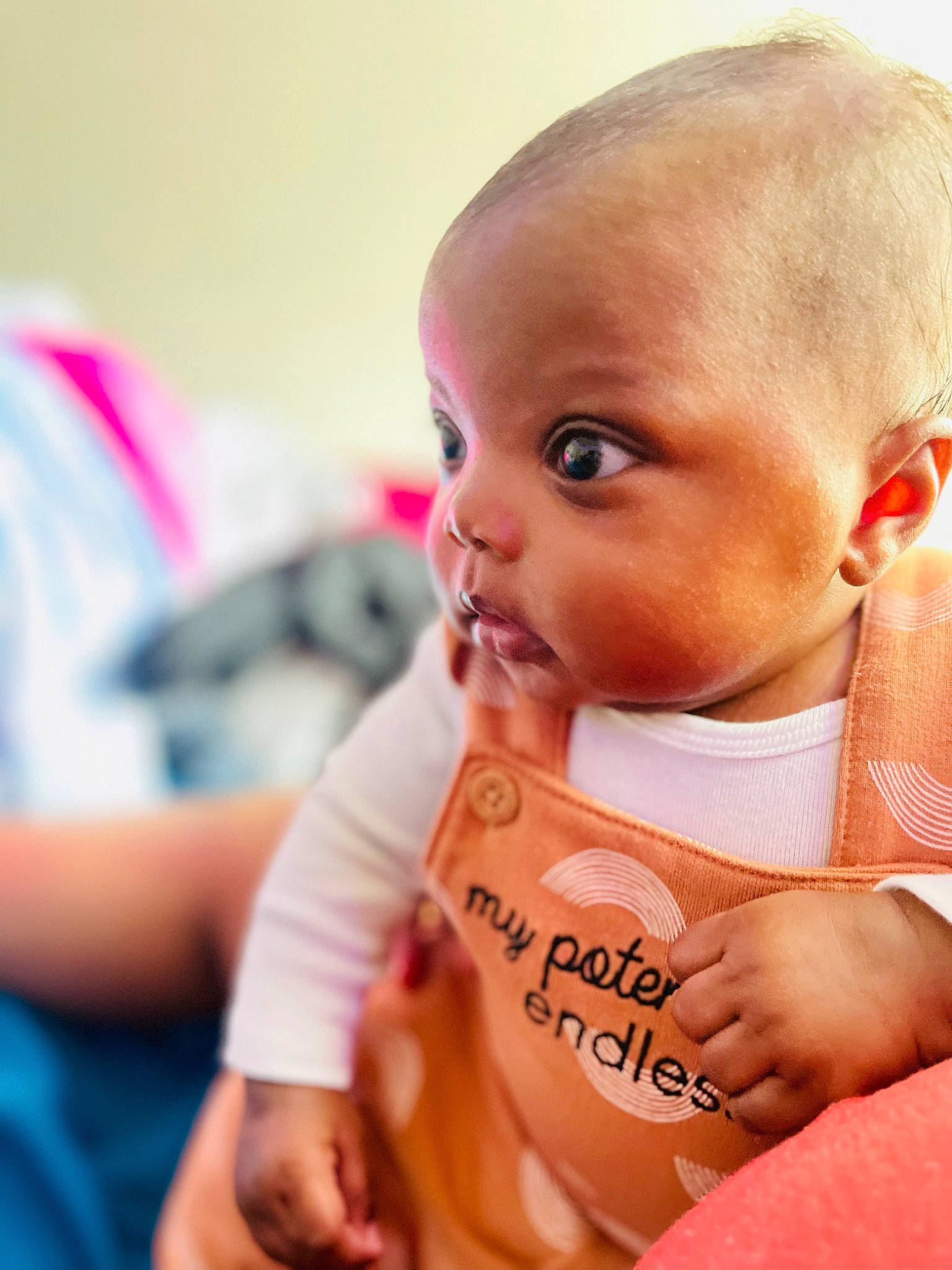 Khalia is registered to the contest to win money with this photo: baby, baby_products, baby_toddler_clothing, cheek, comfort, ear, eyebrow, eyelash, finger, happy, human_body, iris, lip, neck, nose, person, sitting, sleeve, t_shirt, thumb