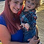 Logan joined the competition — help win amazing prizes! woman, child, toddler, smile, curly_hair, pink_hair, plaid_shirt, jeans, outdoor, sunlight, holding, tattoo, sidewalk, casual_clothing, happy, portrait, daylight, person, nature, skin