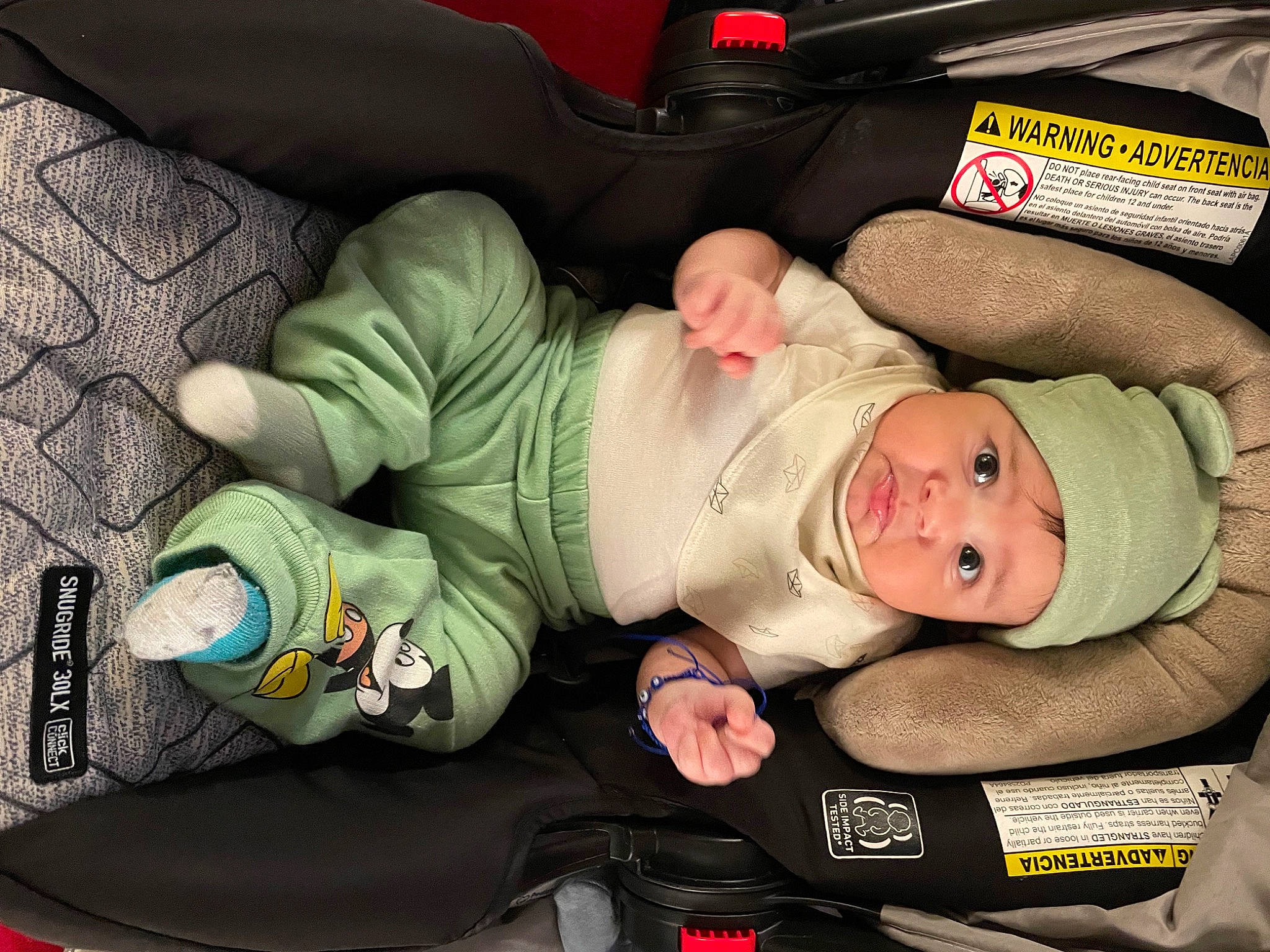 Makoa is registered to the contest to win money with this photo: baby, baby_carriage, baby_products, baby_safety, baby_sleeping, baby_toddler_clothing, car_seat, child, comfort, hat, head, headwear, human_body, lap, person, smile, toddler