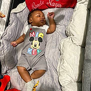 Raedin joined the competition — help win amazing prizes! baby, sleeping, romper, mickey_mouse, plush_toys, cushions, playpen, infant, cozy, soft, child, clothing, cute, indoor, resting, sock, comfort, peaceful, nap, head