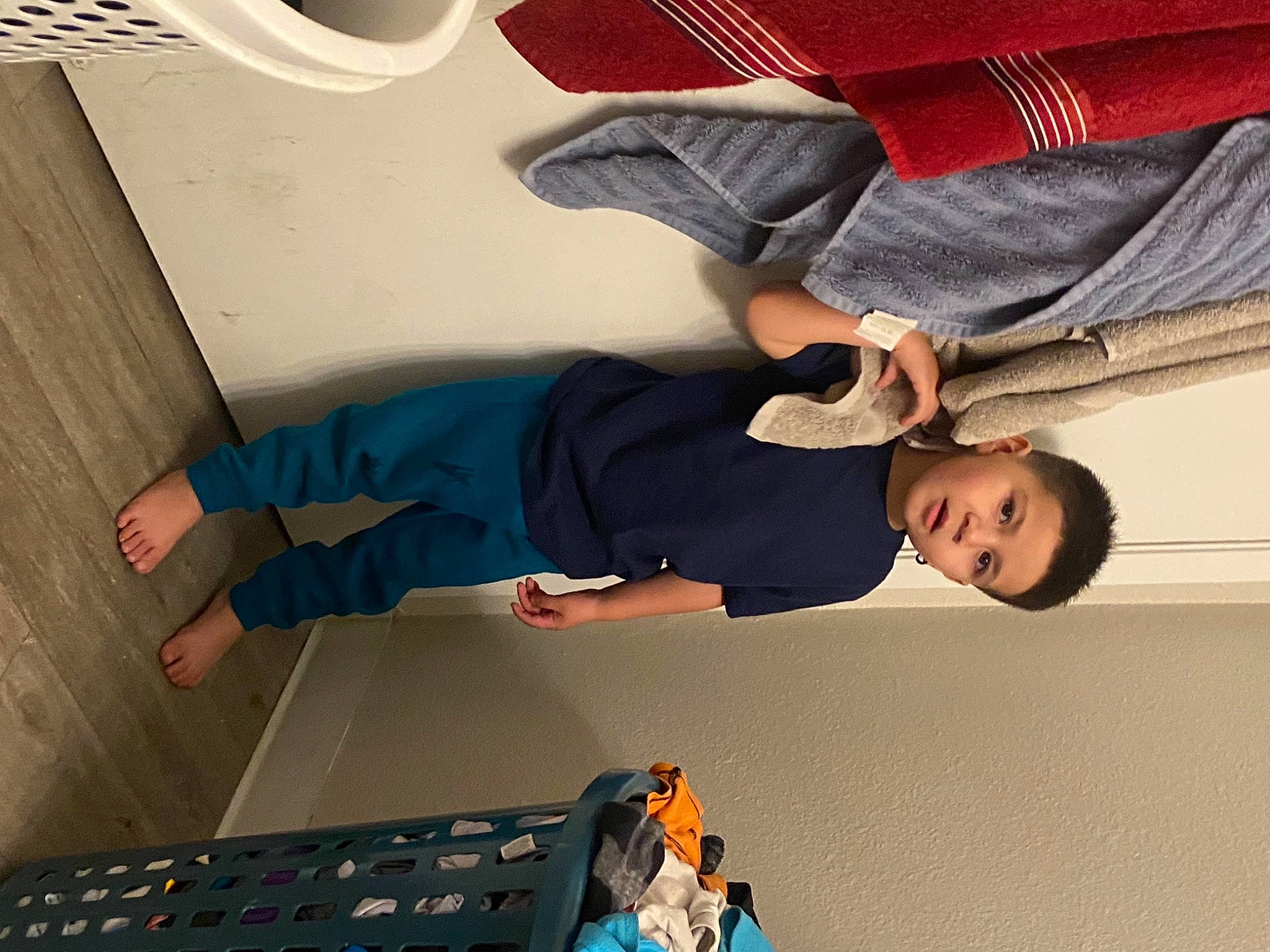 Jaden is registered to the contest to win money with this photo: ceiling, child, denim, elbow, flooring, fun, gesture, human_leg, joint, knee, person, shoe, sleeve, sneakers, sportswear, t_shirt, thigh, toddler, white