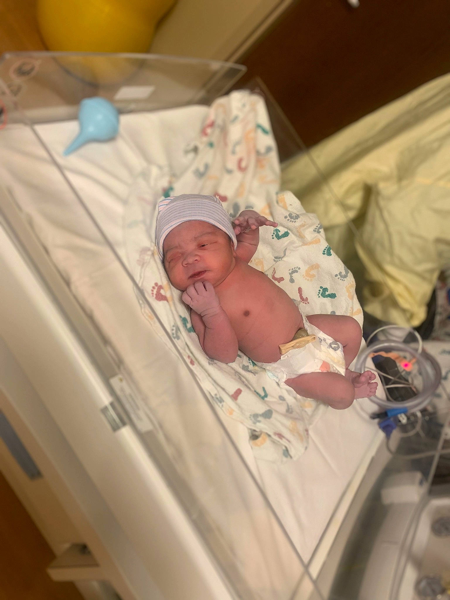 Freddie joined the competition — help win amazing prizes! baby, baby_products, baby_safety, baby_sleeping, baby_toddler_clothing, bed, bedding, bedtime, child, comfort, event, fruit, hat, headwear, hospital, infant_bed, linens, medical_equipment, person, room