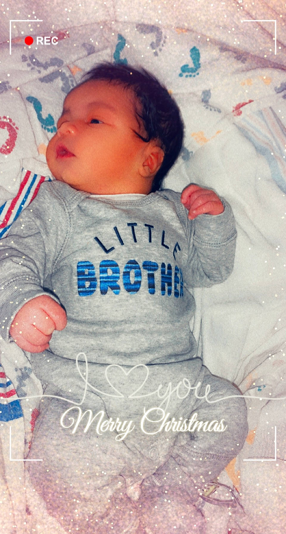 Freddie is registered to the contest to win money with this photo: azure, baby, baby_products, baby_toddler_clothing, beauty, cheek, child, face, facial_expression, happy, head, linens, nose, pattern, person, pink, skin, sleeve, t_shirt, textile