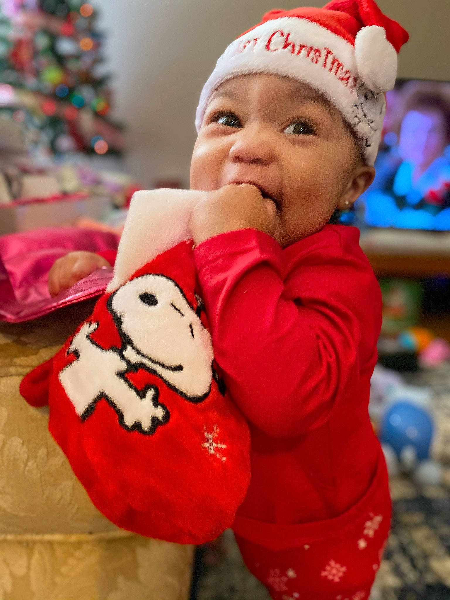 Amyra joined the competition — help win amazing prizes! baby, baby_toddler_clothing, beauty, cap, child, christmas, christmas_tree, face, facial_expression, fun, happy, head, headwear, outerwear, people, person, photograph, pink, red, sleeve