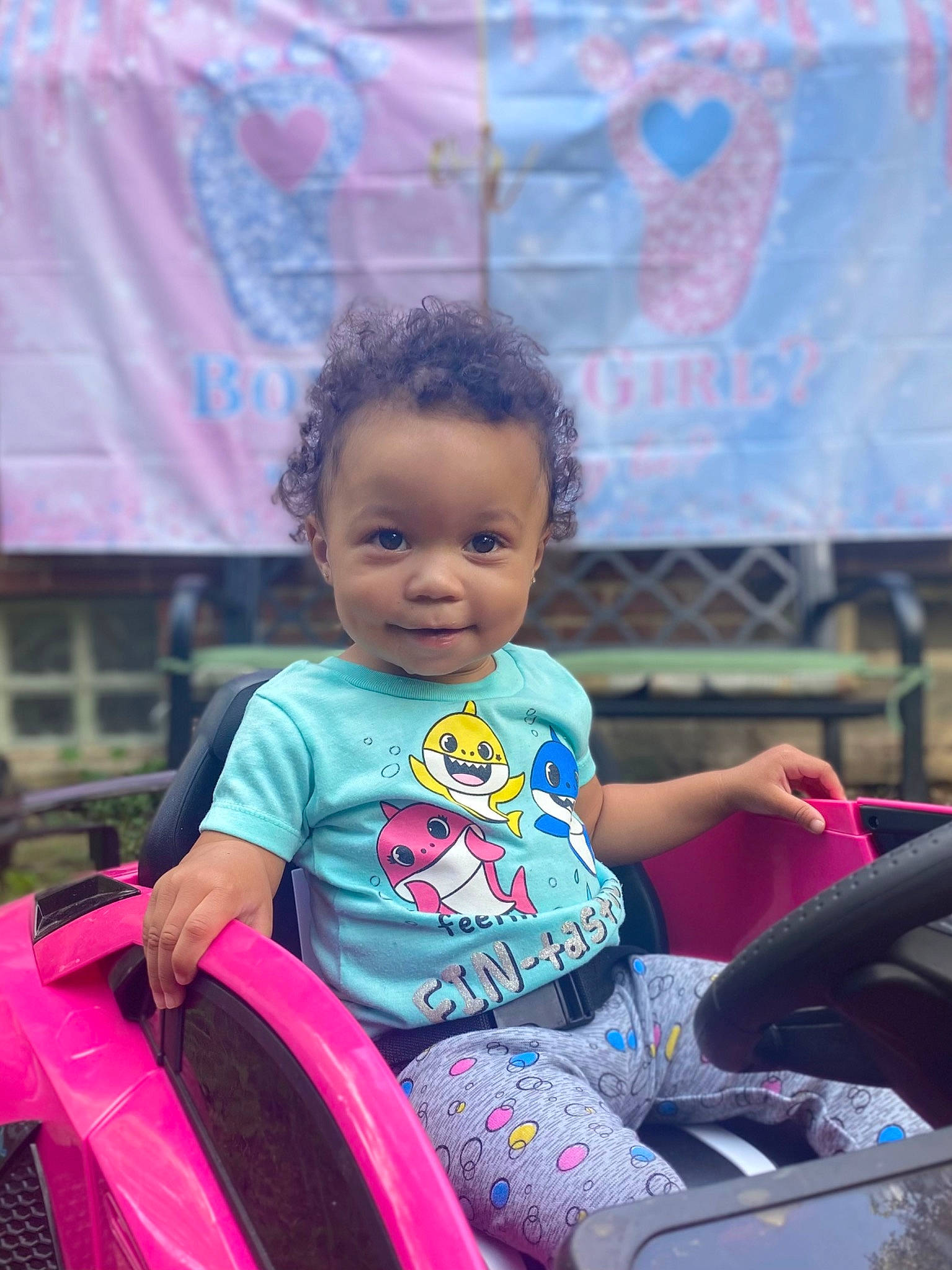 Amyra is registered to the contest to win money with this photo: beauty, black_hair, child, fun, hairstyle, happy, leisure, magenta, motor_vehicle, organ, person, pink, product, purple, recreation, riding_toy, sitting, skin, smile, toddler