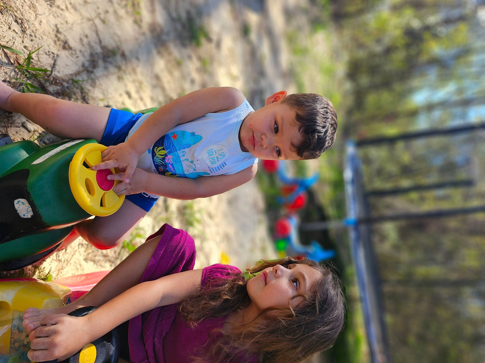 Serenity is registered to the contest to win money with this photo: adventure, child, fun, grass, happy, human_leg, landscape, leg, leisure, people_in_nature, person, plant, recreation, sandal, shorts, sitting, soil, summer, thigh, tire