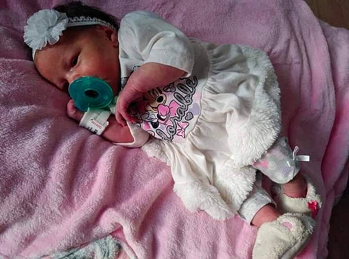 Renesmee is registered to the contest to win money with this photo: baby, baby_products, baby_sleeping, baby_toddler_clothing, beanie, bedding, blanket, child, comfort, companion_dog, headwear, linens, magenta, pattern, person, pink, purple, sleeve, t_shirt, textile