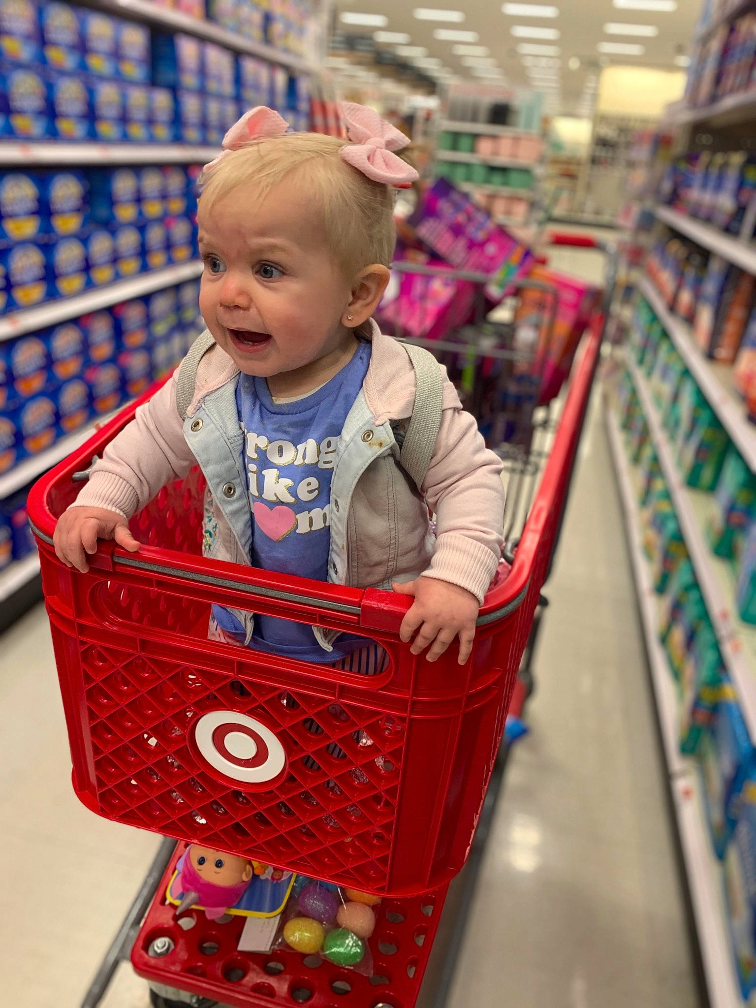 Everleigh Alexa is registered to the contest to win money with this photo: baby, beauty, blue, cart, child, customer, fun, grocery_store, people, person, photograph, product, publication, retail, service, shelf, shopping, shopping_cart, snapshot, tire
