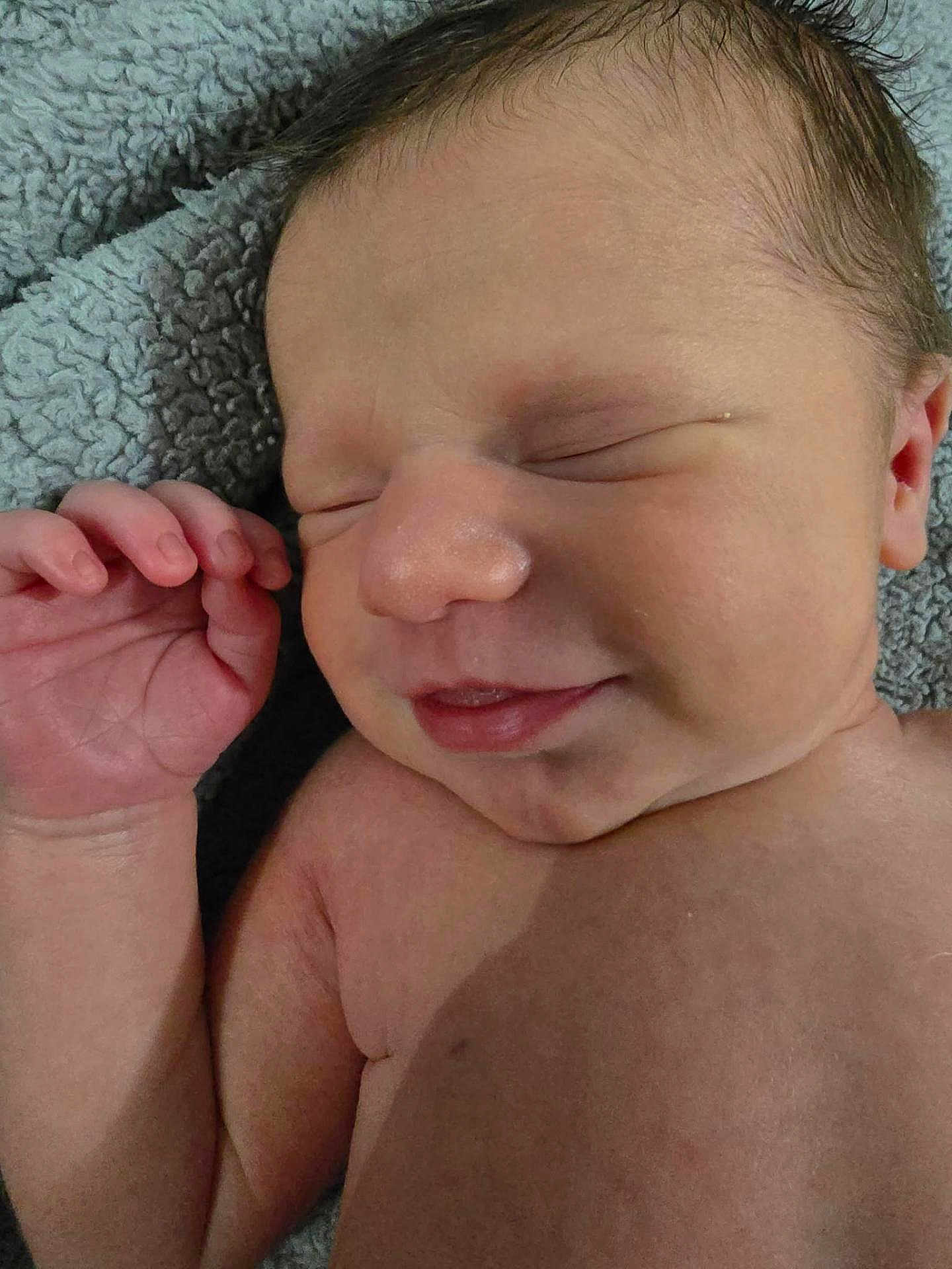Onyx is registered to the contest to win money with this photo: newborn, baby, infant, sleeping, smile, face, hand, skin, closeup, portrait, cute, soft, blanket, peaceful, young, child, human, natural, relaxing, expression