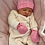 baby, blanket, child, comfortable, cozy, cute, indoors, infant, newborn, peaceful, pink_hat, pink_mittens, portrait, resting, sleeping, snug, soft_texture, tiny_hands, warm_clothing, white_outfit