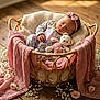baby, basket, blanket, cozy, cute, decor, flower, handmade, headband, indoor, infant, knitted, peaceful, pink, portrait, resting, sleeping, soft_lighting, teddy_bear, wooden_floor