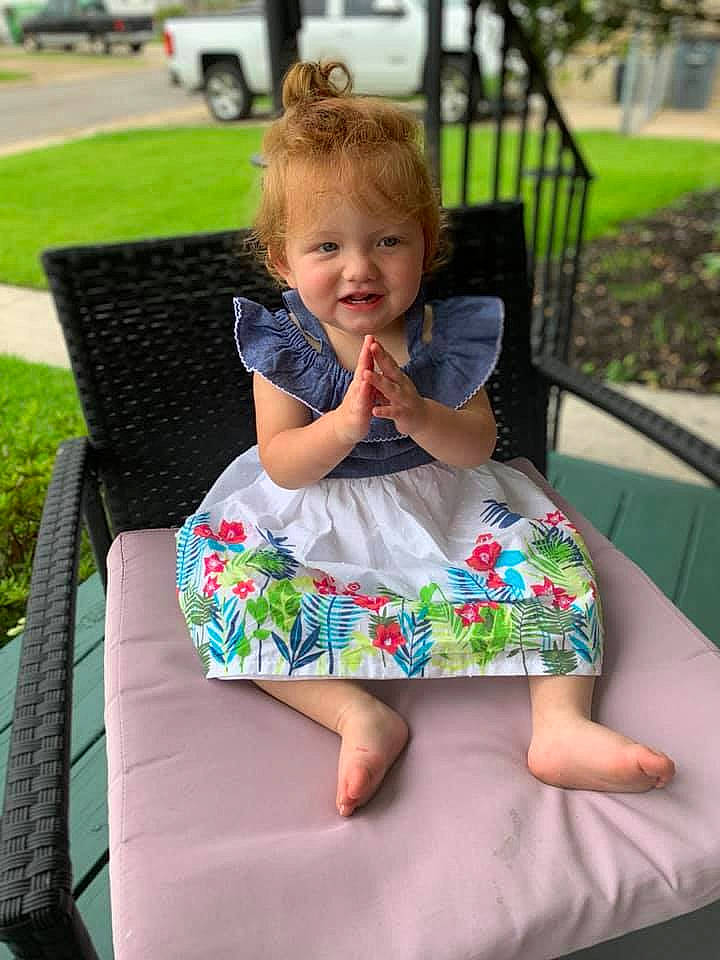 Carly is registered to the contest to win money with this photo: auto_part, baby, baby_products, chair, child, furniture, games, grass, leisure, person, play, product, recreation, sitting, summer, toddler, vacation