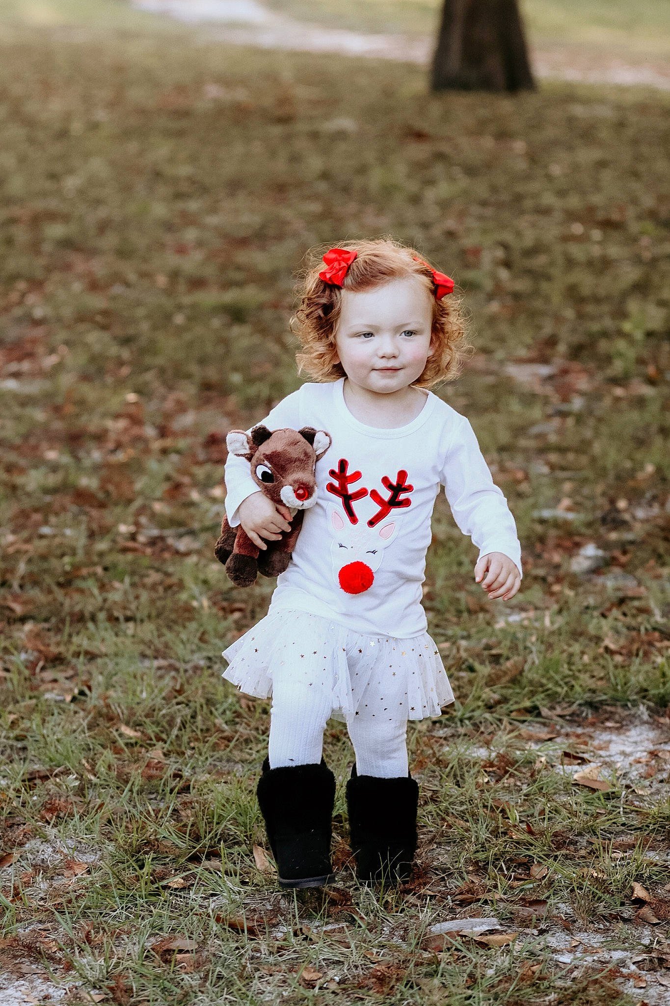 Carly is registered to the contest to win money with this photo: autumn, child, fun, grass, leaf, people_in_nature, person, play, toddler