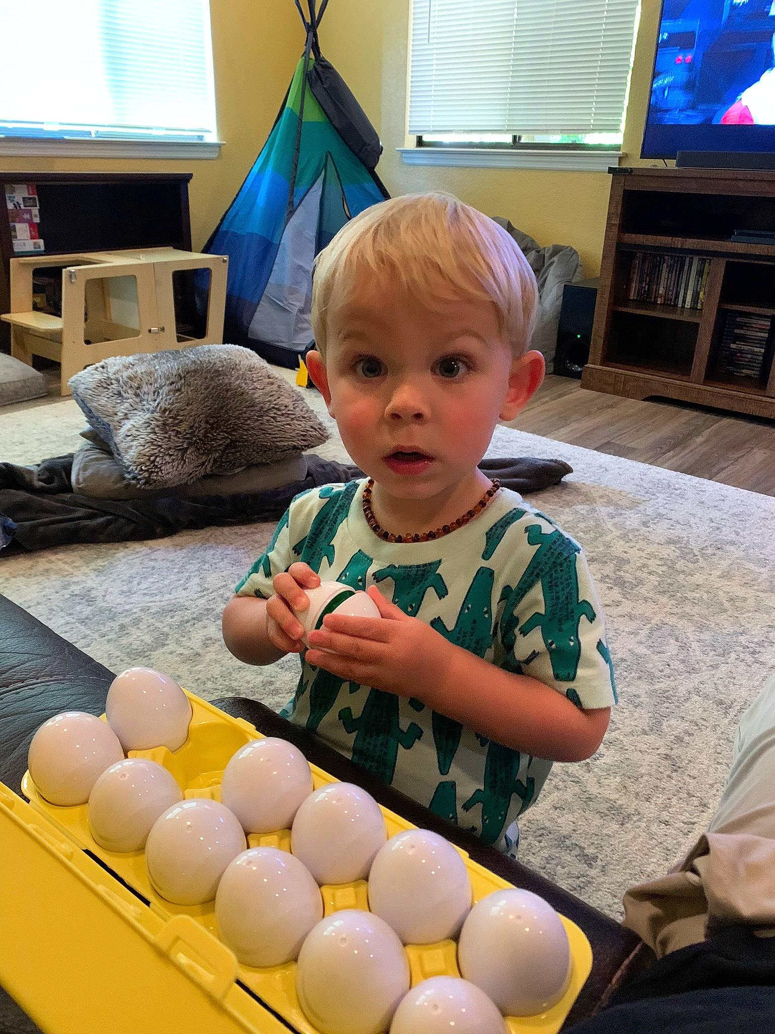 Orion joined the competition — help win amazing prizes! baby_toddler_clothing, bookcase, cable_television, child, couch, display_device, entertainment_center, flooring, green, home_appliance, lamp, led_backlit_lcd_display, living_room, person, picture_frame, room, surprise, television, television_set, toddler