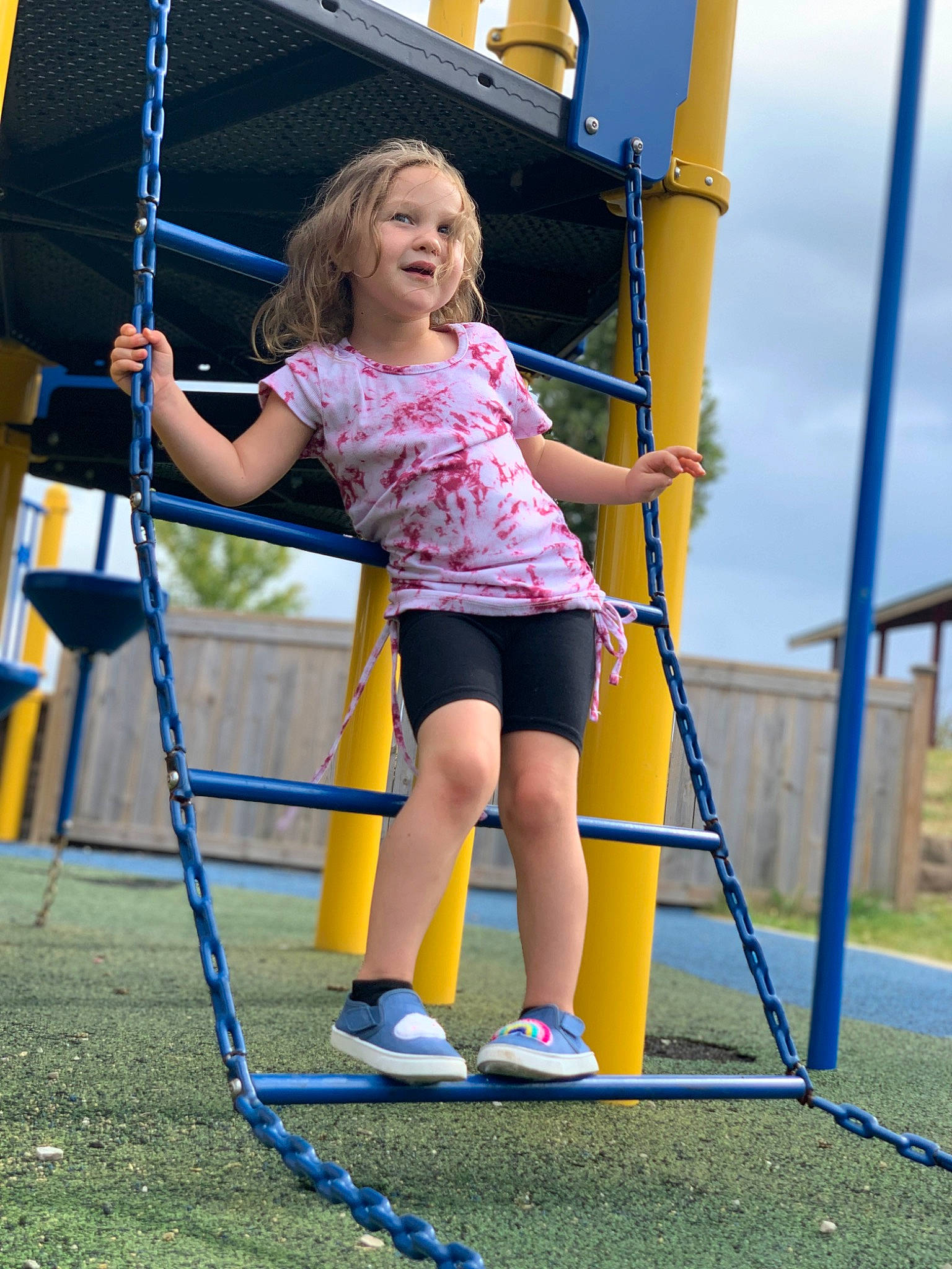 Everlee is registered to the contest to win money with this photo: beauty, blue, child, city, cloud, electric_blue, fun, grass, leisure, outdoor_play_equipment, person, playground, public_space, recreation, shorts, sky, smile, summer, t_shirt, white