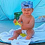 baby, barefoot, blue_tent, cap, child, cute, diaper, happy, hat, infant, outdoor, playing, sitting, smile, summer, tent, toddler, towel, toy, yellow_toy
