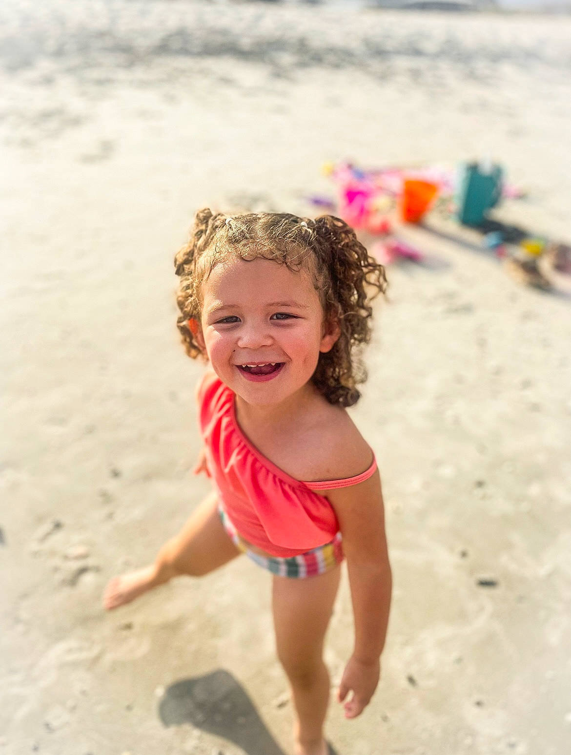 Kenlynn is registered to the contest to win money with this photo: barefoot, beach, body_of_water, child, coast, fun, happy, head, joy, leisure, ocean, people_in_nature, people_on_beach, person, play, sand, shore, smile, summer, thigh