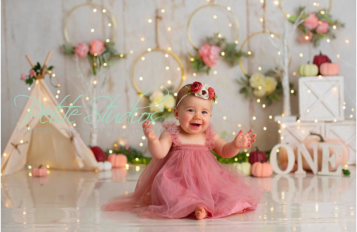 Lilly is registered to the contest to win money with this photo: child, christmas_decoration, christmas_ornament, decoration, dress, event, fun, happy, headpiece, headwear, icing, joy, magenta, ornament, party_supply, person, petal, pink, plant, smile