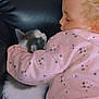 Georgie joined the competition — help win amazing prizes! affection, cat, child, close_up, cozy, cuddle, curly_hair, cute, floral_pattern, indoor, kitten, leather_couch, nap, pet, pink_jacket, resting, sleeping, soft_lighting, toddler, young_child