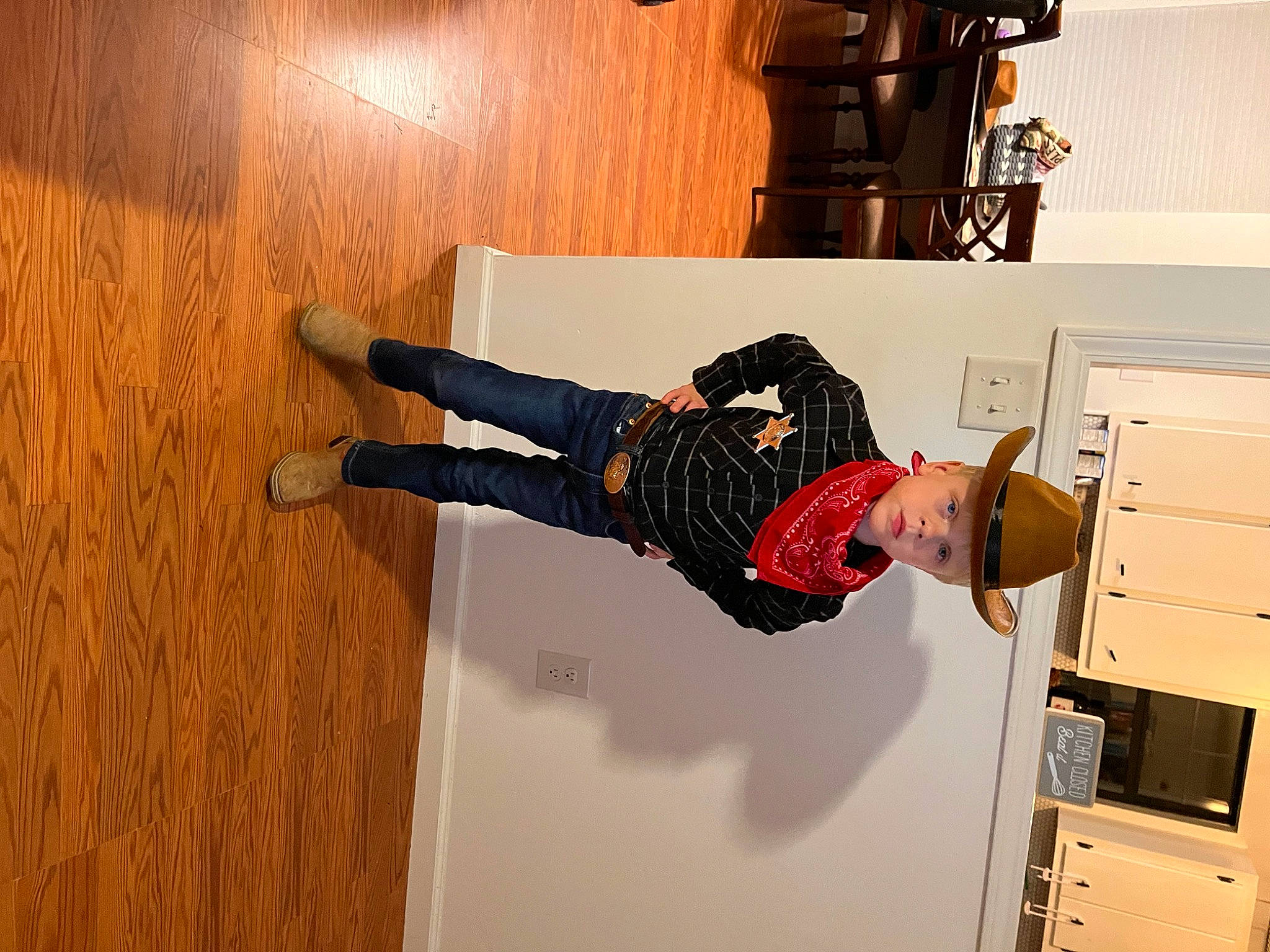 Malaki is registered to the contest to win money with this photo: box, cabinetry, chest_of_drawers, cupboard, drawer, flooring, hardwood, headwear, human_leg, knee, locker, machine, person, room, shoe, sneakers, sock, sportswear, thigh, walking_shoe