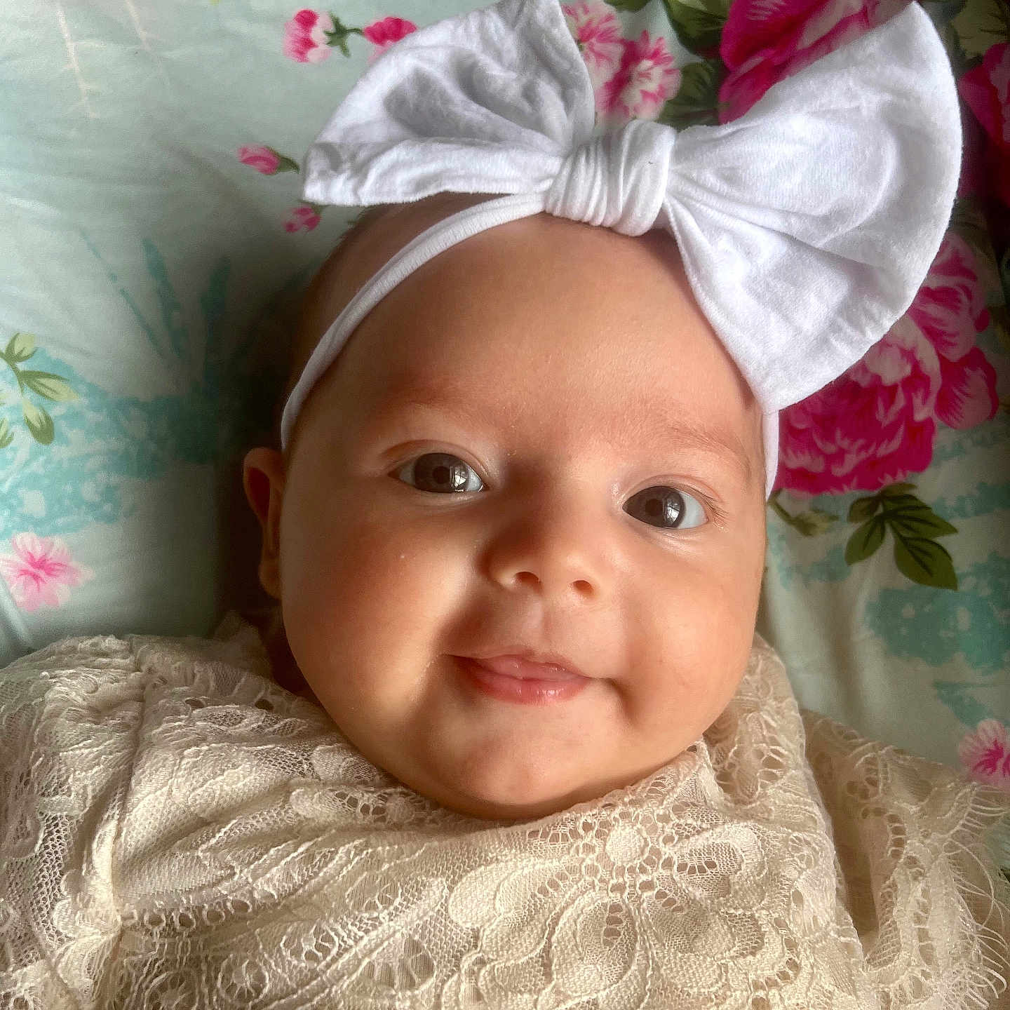 Mckenna is registered to the contest to win money with this photo: accessories, baby, bonnet, clothing, dress, face, flower, happy, hat, head, headband, homedecor, linen, newborn, person, photography, plant, portrait, rose, smile