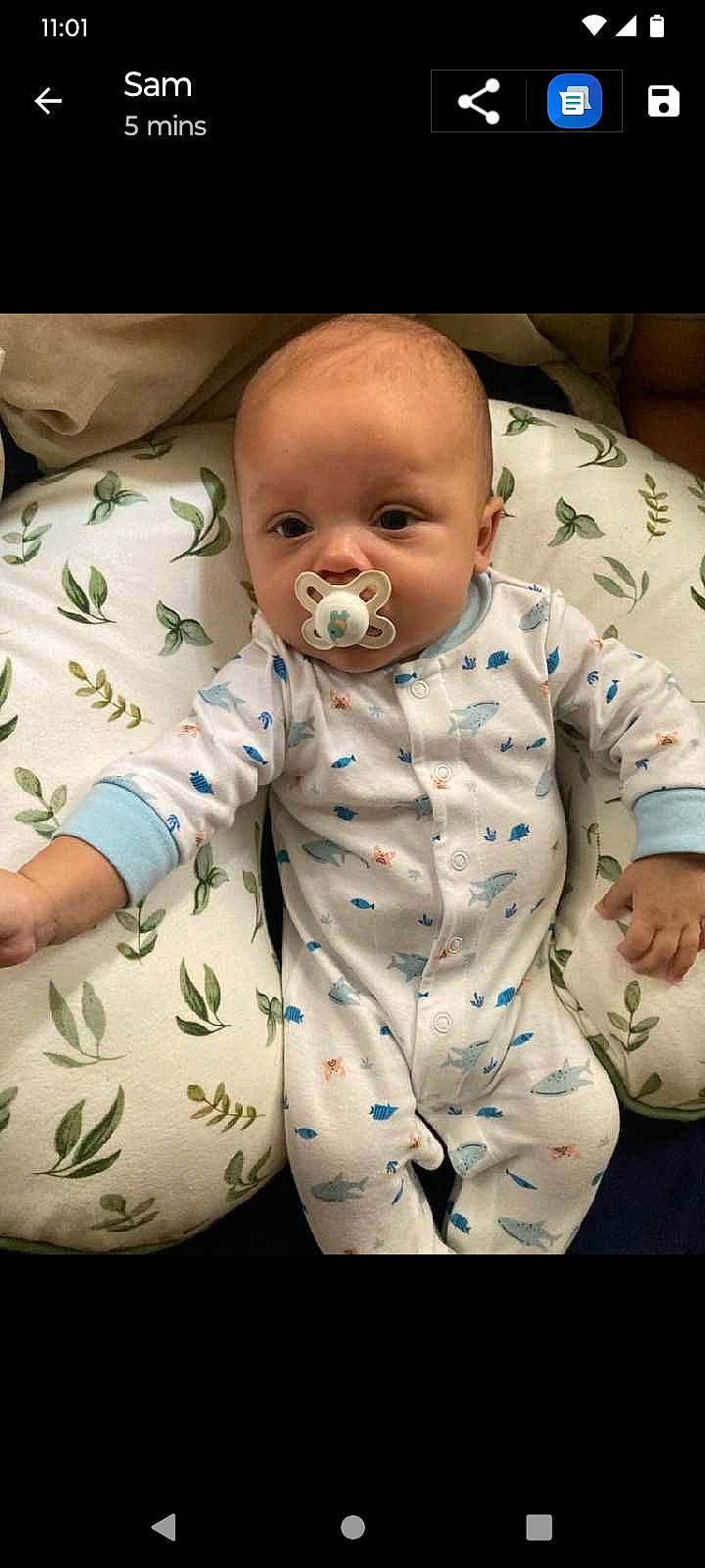 Nikolai is registered to the contest to win money with this photo: arm, baby, baby_products, baby_safety, baby_sleeping, baby_toddler_clothing, cheek, chest, chin, comfort, face, head, human_body, infant_bodysuit, linens, nose, person, sitting, sleeve, stomach