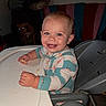 Nova joined the competition — help win amazing prizes! toddler, child, high_chair, smiling, indoor, food, messy, dog, eyes, blue_eyes, face, hands, clothing, seat, blanket, pillow, furniture, home, happy, pet