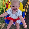 child, toddler, swing, outdoor, grass, tree, playground, toy, happy, laughing, summer, barefoot, clothing, plastic_swing, nature, sunlight, fun, play, person, recreation