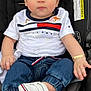 Matthew joined the competition — help win amazing prizes! baby, child, car_seat, clothing, white_shirt, denim_pants, sneakers, footwear, face, person, jewelry, bracelet, pin, seat, black_background, cute, infant, portrait, casual, fashion