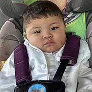 Remington joined the competition — help win amazing prizes! toddler, child, car_seat, safety_harness, white_jacket, purple_straps, buzz_lightyear, toy_story, seat_cover, young_child, portrait, indoors, serious_expression, baby, cute, seatbelt, car_interior, closeup, face, person