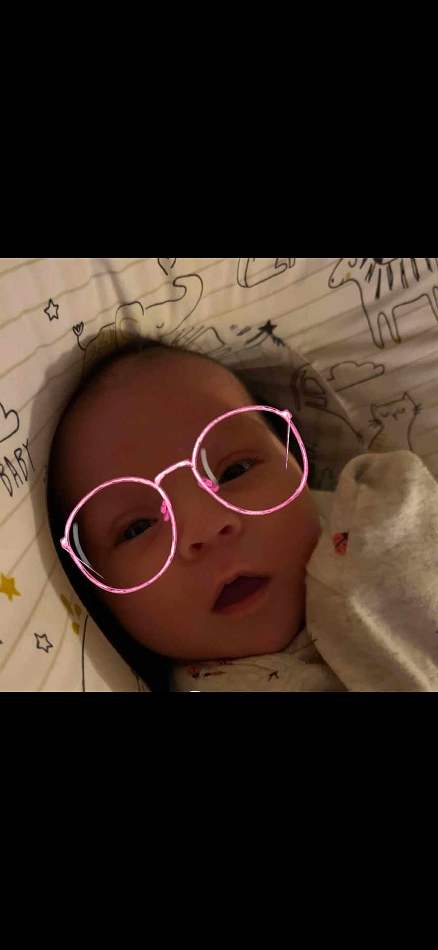 Graylee joined the competition — help win amazing prizes! baby, face, glasses_filter, digital_effect, blanket, animal_drawings, cute, infant, lying_down, portrait, child, indoors, cozy, soft_lighting, expression, clothing, head, skin, eyes, mouth