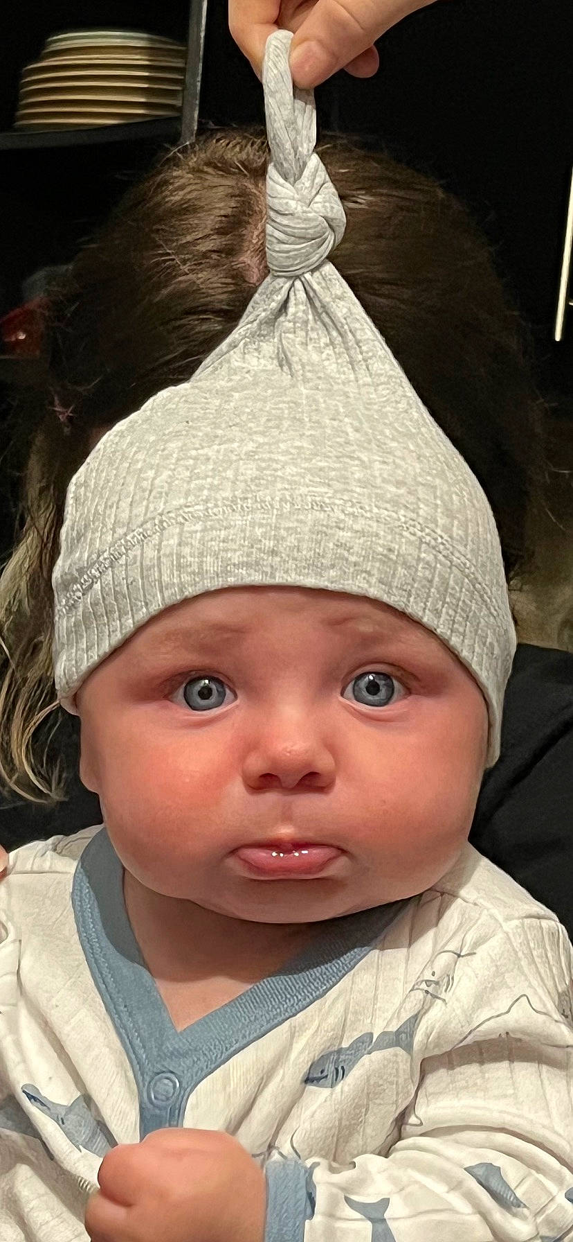 Kylo is registered to the contest to win money with this photo: baby, beanie, cap, cheek, child, chin, costume_hat, eye, fashion_accessory, forehead, headgear, headwear, knit_cap, lip, person, portrait_photography, skin, smile, textile, toddler