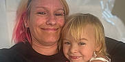 Raelynn is registered to the contest to win money with this photo: adult, affection, bed, blanket, casual, child, clothing, family, hair, happy, hug, indoor, light, love, person, portrait, shadow, skin, smile, toddler