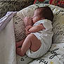 Lilith joined the competition — help win amazing prizes! baby, newborn, infant, sleeping, pillow, blanket, mitten, onesie, cushion, bed, fabric_pattern, side_profile, indoors, cozy, portrait, peaceful, cute, skin, hair, lying_down