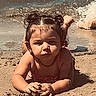 Mila Raine joined the competition — help win amazing prizes! toddler, child, beach, sand, water, waves, sunny, curly_hair, playing, outdoor, summer, vacation, cute, young_child, fun, nature, holiday, sand_play, lying_down, daylight