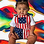 baby, child, infant, patriotic_clothing, stars_and_stripes, blue_bow, sitting, chubby, colorful_background, abstract_art, cute, portrait, smiling, skin, face, legs, feet, hands, white_shirt, fashion