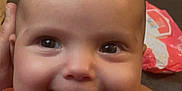 Remy joined the competition — help win amazing prizes! baby, cheeks, child, closeup, clothing, cute, eyes, face, floral_pattern, hand, happy, head, human, indoors, infant, mouth, person, portrait, skin, smiling