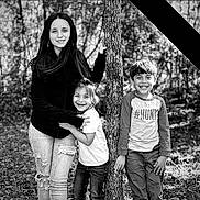 Ava is registered to the contest to win money with this photo: black_and_white, boy, casual_clothing, child, children, daylight, forest, girl, happy, jeans, laughing, long_hair, nature, outdoor, playful, portrait, short_hair, sibling, smiling, tree