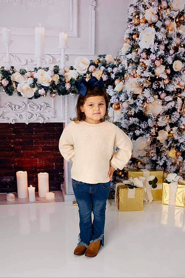 Kaizlee is registered to the contest to win money with this photo: beauty, child, christmas, christmas_decoration, christmas_ornament, christmas_tree, conifer, denim, event, fir, fun, holiday, ornament, person, pine, pine_family, room, textile, toddler, winter