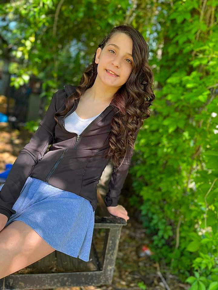 Kyra joined the competition — help win amazing prizes! black_hair, brown_hair, denim, electric_blue, fashion_design, fashion_model, flash_photography, grass, happy, human_leg, joy, knee, long_hair, people_in_nature, person, shoulder, sitting, sleeve, smile, thigh