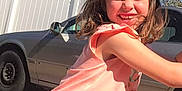 Kinlee Raye is registered to the contest to win money with this photo: car, casual_wear, child, cute, daylight, fence, girl, hair_bow, happy, joyful, nature, outdoor, patterned_shorts, person, pink_clothing, playful, smiling, summer, sunny, young