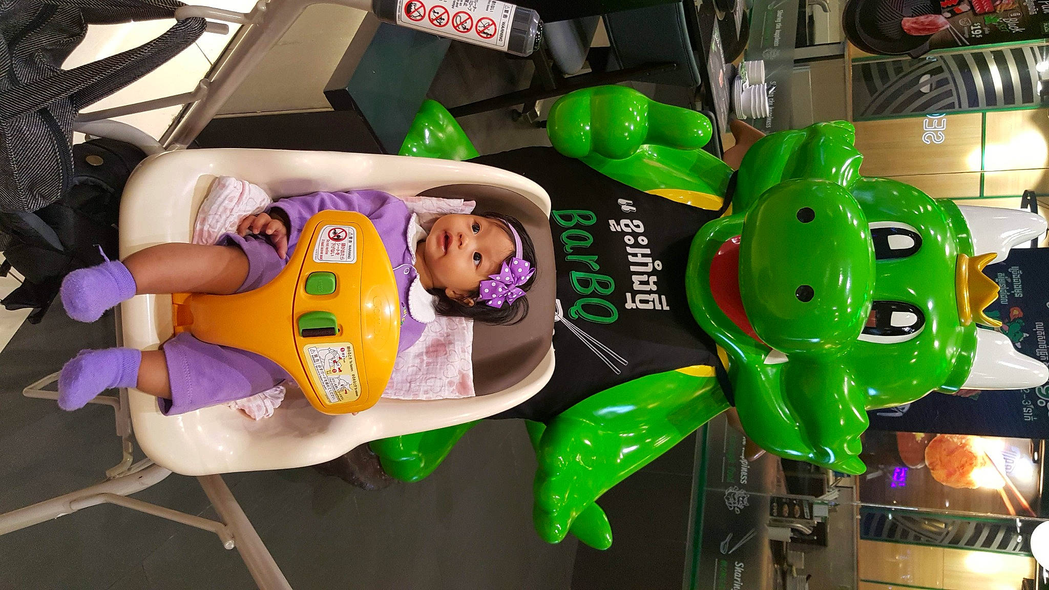 Angelina joined the competition — help win amazing prizes! baby_products, child, event, fun, green, hat, headwear, leisure, machine, motor_vehicle, party_supply, person, plastic, play, product, recreation, snapshot, toddler, toy