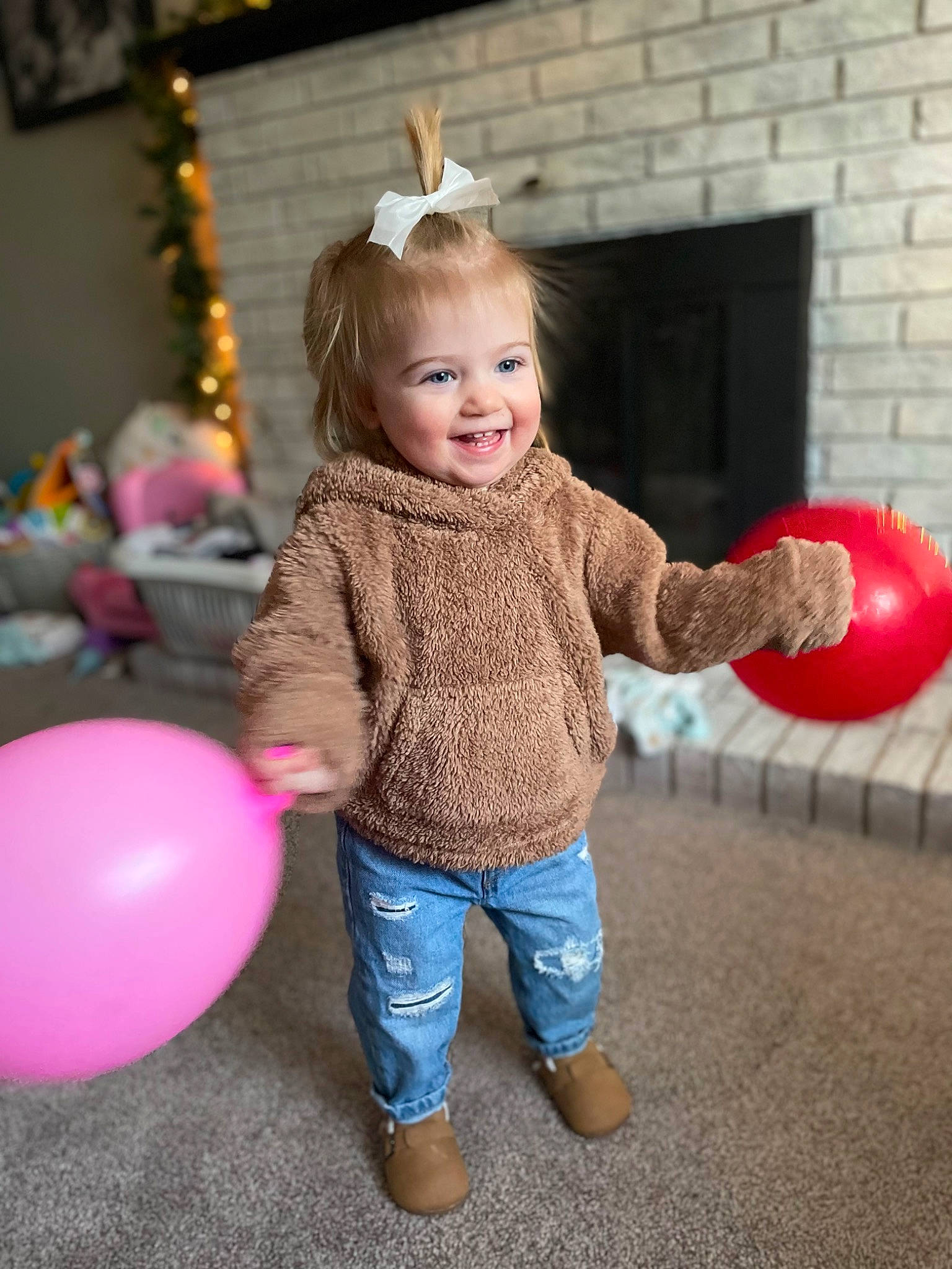 Blake is registered to the contest to win money with this photo: baby_toddler_clothing, balloon, blond, child, face, facial_expression, fun, hair, hairstyle, happy, head, human_body, jeans, joy, leg, leisure, person, pink, skin, smile