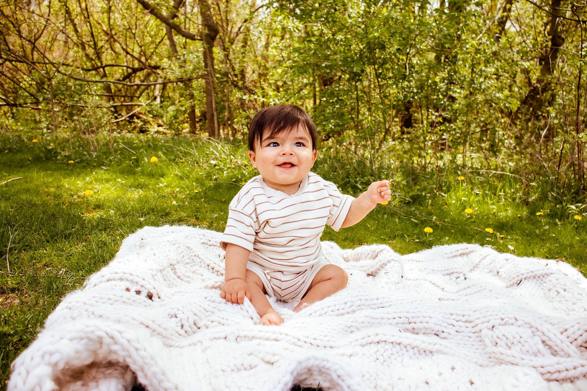 Luca is registered to the contest to win money with this photo: baby, baby_toddler_clothing, child, forest, fun, garden, grass, happy, joy, leisure, people_in_nature, person, plant, portrait_photography, recreation, shorts, sitting, t_shirt, toddler, tree