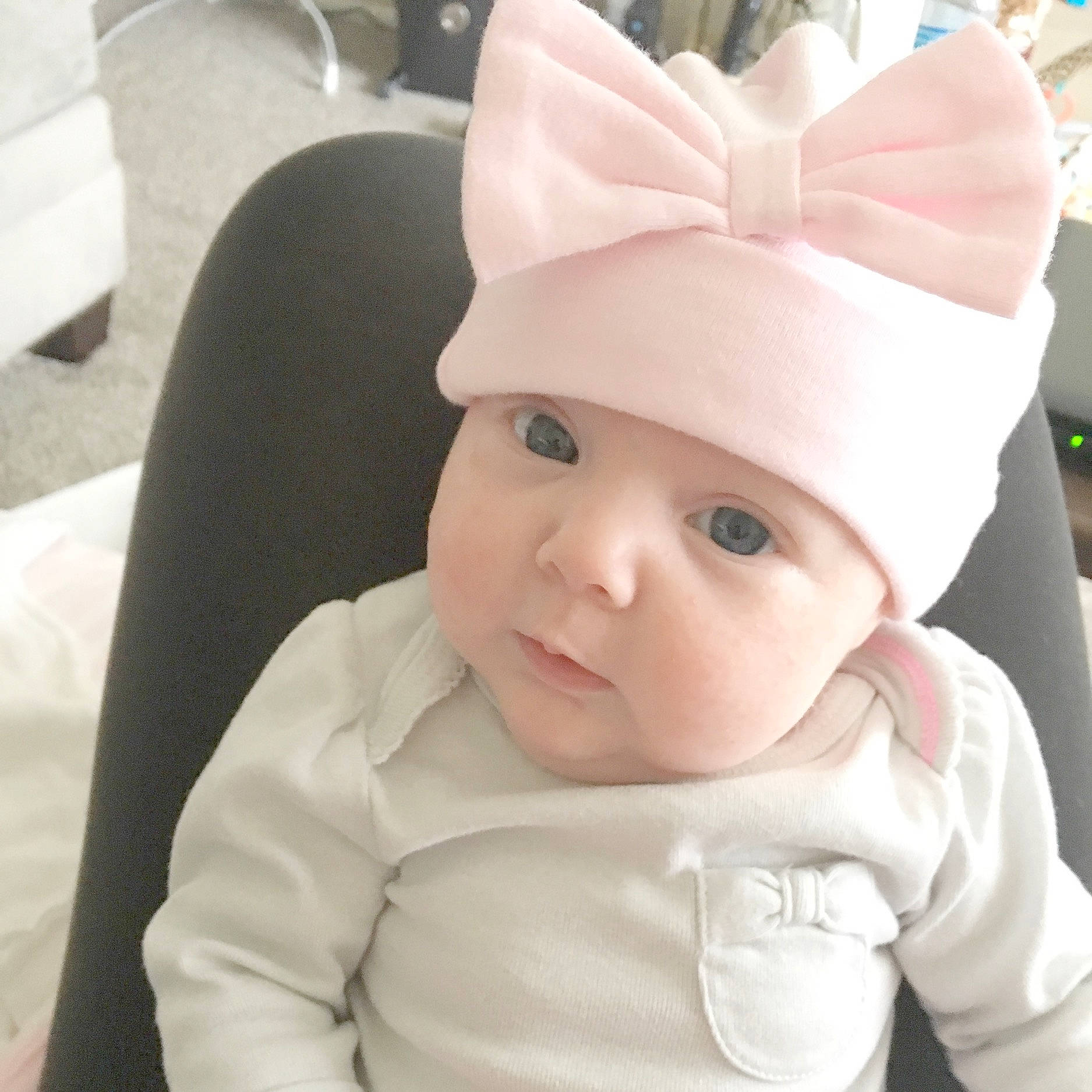 Mercy is registered to the contest to win money with this photo: baby, beauty, cheek, child, ear, eye, face, fashion_accessory, forehead, head, headgear, lip, organ, person, pink, skin, smile, toddler