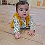 baby, child, floor, wooden_floor, indoor, person, clothing, yellow, curious, face, hands, crawling, home, stairs, door, expression, infant, portrait, cozy, casual