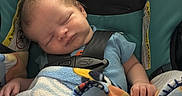 Colt joined the competition — help win amazing prizes! newborn, baby, infant, sleeping, car_seat, seatbelt, blanket, blue, turquoise, portrait, face, closed_eyes, indoors, cozy, resting, child, vehicle, safety_harness, textile, peaceful