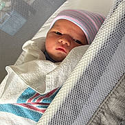 Colt joined the competition — help win amazing prizes! newborn, baby, infant, child, face, portrait, sleeping, awake, swaddle, blanket, hat, knit_cap, bassinet, crib, mesh, nursery, indoors, cozy, striped, photography