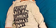 Jaxon is registered to the contest to win money with this photo: baby, blanket, camo_pants, casual, child, clothing, comfortable, curious, cushion, cute, face, hoodie, indoor, infant, lying_down, person, portrait, relaxed, socks, young_child