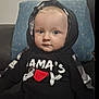 Jaxon is registered to the contest to win money with this photo: baby, black_clothing, blue_eyes, casual_clothing, child, comfortable, couch, cozy, cushion, expressionless, face, home, hoodie, indoor, infant, person, portrait, sitting, text_on_clothing, young_child